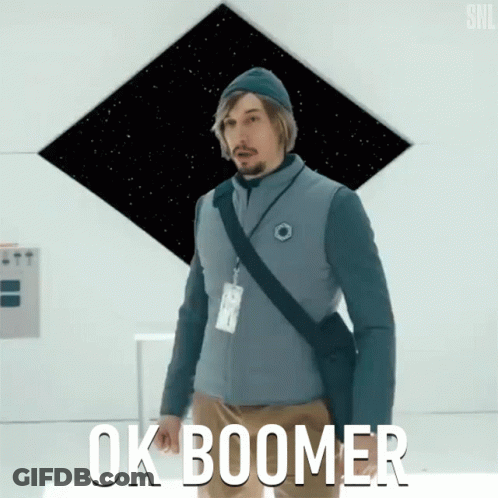 A Man With A Lanyard Around His Neck Says Ok Boomer In White Letters GIF