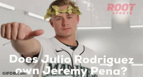 A Man With A Laurel Wreath On His Head Pointing At The Camera GIF