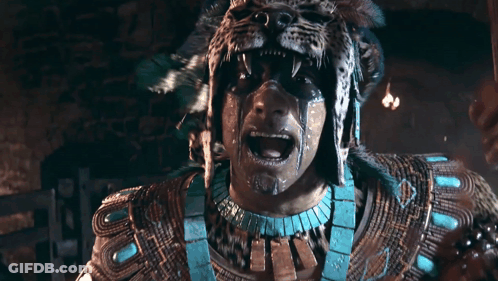 A Man With A Leopard Mask On His Face Screams GIF