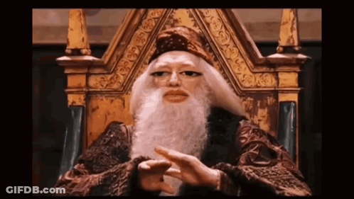 A Man With A Long Beard Is Sitting On A Throne GIF