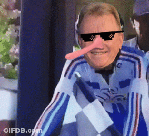 A Man With A Long Nose Wearing Sunglasses And A Blue Jacket GIF