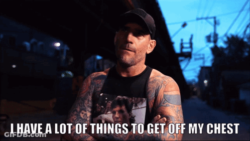 A Man With A Lot Of Tattoos Has The Words I Have A Lot Of Things To Get Off My Chest Below Him GIF