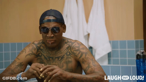 A Man With A Lot Of Tattoos Is Sitting In A Bathtub With Laugh Out Loud Written On The Bottom GIF