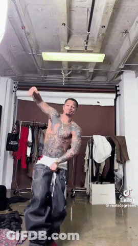 Tattooed Man Dancing In Room GIF