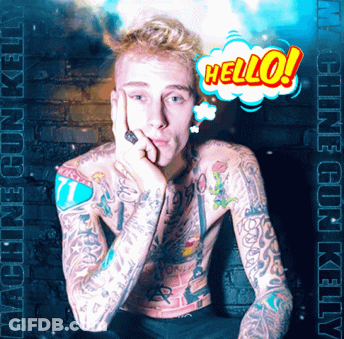 A Man With A Lot Of Tattoos Says Hello In A Comic Bubble GIF
