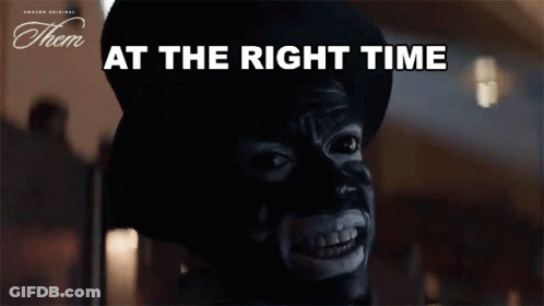 A Man With A Mask On His Face And The Words At The Right Time Below Him GIF