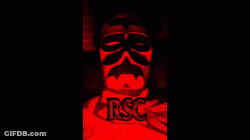 Man In Mask Sitting In Red Light GIF