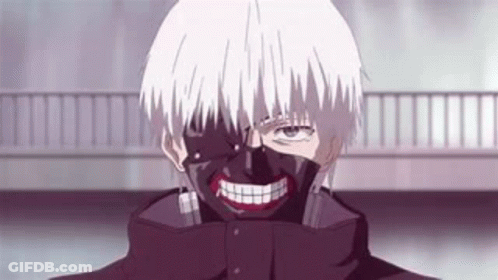 A Man With A Mask On His Face Is Smiling . GIF