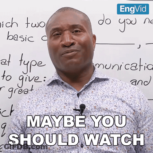 A Man With A Microphone In Front Of A Whiteboard That Says Maybe You Should Watch GIF
