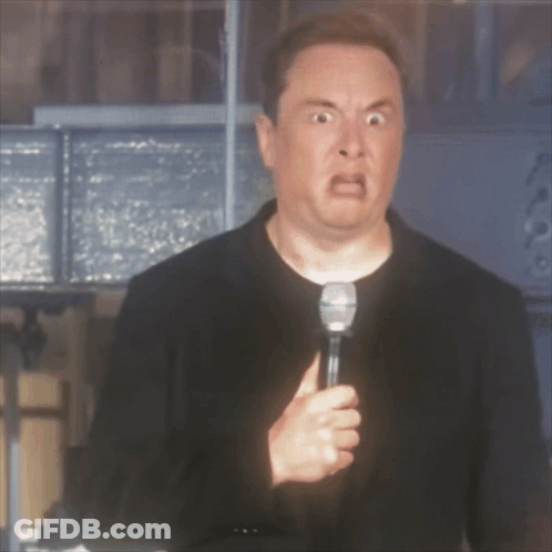 A Man With A Microphone Making A Funny Face GIF