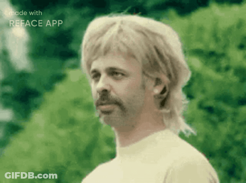 A Man With A Mullet And A Beard Is Made With The Reface App GIF