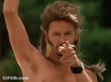 A Man With A Mullet And A Beard Is Smoking A Cigarette And Pointing . GIF