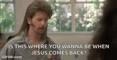 A Man With A Mullet And A Beard Is Talking To A Woman In Front Of A Window . GIF