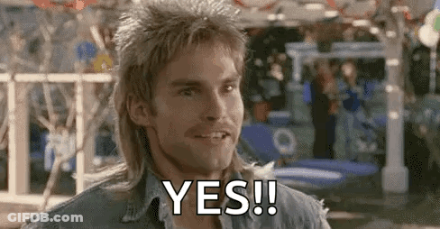 A Man With A Mullet Is Smiling And Saying `` Yes '' . GIF