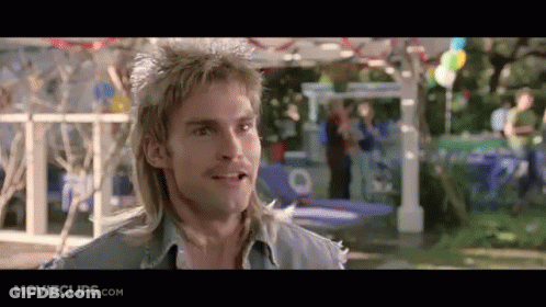 A Man With A Mullet Is Smiling In A Movie Clip From Movieclips.com . GIF