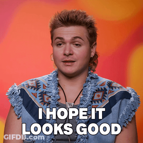 A Man With A Mullet Says " I Hope It Looks Good " While Wearing A Blue Vest GIF