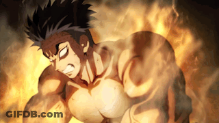A Man With A Muscular Body Is Standing In Front Of A Fire GIF