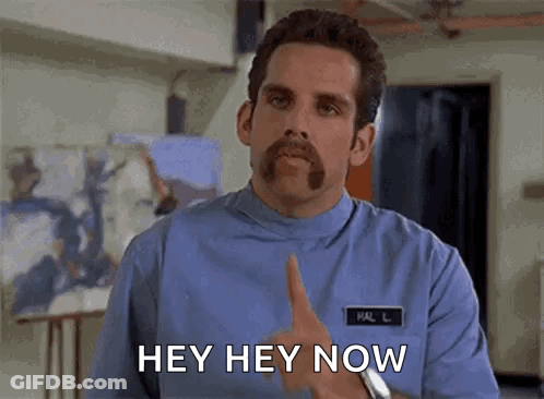 A Man With A Mustache And A Name Tag That Says Hal Is Giving A Thumbs Up And Saying Hey Hey Now . GIF