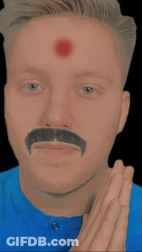 A Man With A Mustache And Red Eyes Has His Hands Together GIF