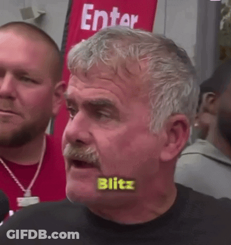 Mustached Man With Blitz Written On Mouth GIF