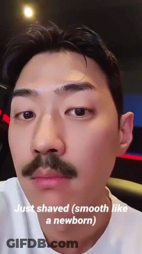 A Man With A Mustache Has The Words Just Shaved Smooth Like A Newborn On His Face GIF