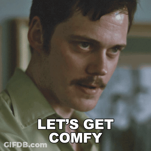 A Man With A Mustache Has The Words Let 'S Get Comfy Below His Face GIF