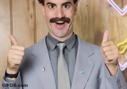 A Man With A Mustache Is Giving Two Thumbs Up GIF