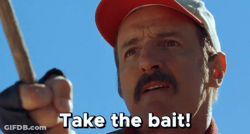 A Man With A Mustache Is Holding A Stick And Says Take The Bait GIF