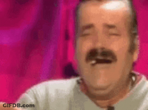 A Man With A Mustache Is Laughing With His Eyes Closed And Smoking A Cigarette . GIF