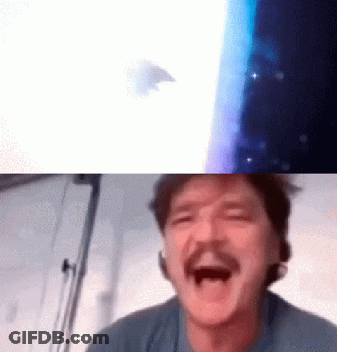 A Man With A Mustache Is Laughing With His Mouth Open In Front Of A Screen . GIF