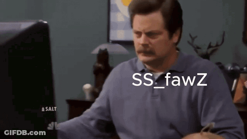 A Man With A Mustache Is Looking At A Computer Screen With The Words Ss Fawz Written On It GIF