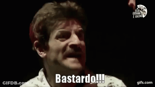 A Man With A Mustache Is Making A Funny Face And Saying Bastard ! GIF