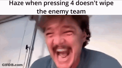 A Man With A Mustache Is Making A Funny Face While Pressing 4 On A Video Game . GIF