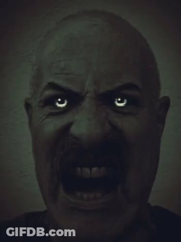 A Man With A Mustache Is Making A Very Angry Face GIF