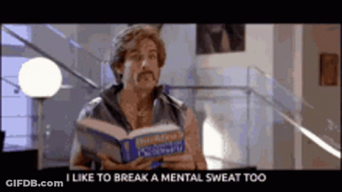A Man With A Mustache Is Reading A Book And Says " I Like To Break A Mental Sweat Too " GIF