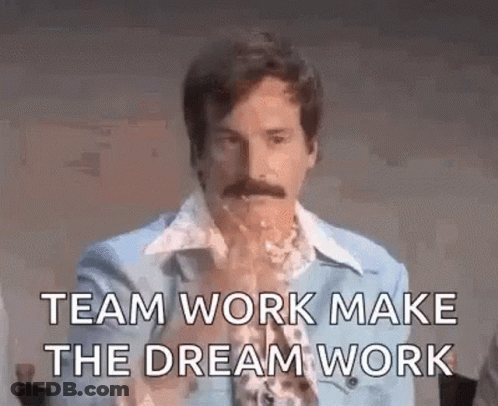 A Man With A Mustache Is Saying `` Team Work Make The Dream Work '' While Drinking From A Glass . GIF