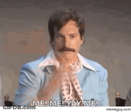 A Man With A Mustache Is Sitting At A Table With His Hands Folded And Saying Me ! Me ! Yay Me ! GIF