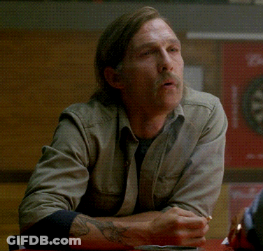 A Man With A Mustache Is Sitting At A Table With The Words Must Be Nice Written On It GIF