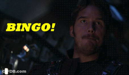 A Man With A Mustache Is Sitting In Front Of A Bingo Sign GIF