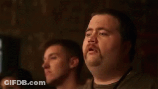 A Man With A Mustache Is Sitting In Front Of A Group Of People And Says This Isn 'T Going To End Well GIF