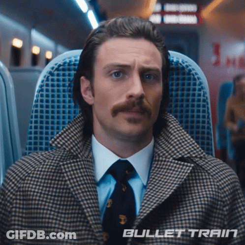Man With Mustache Sitting On Bullet Train GIF