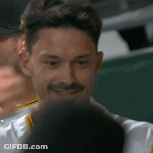 Smiling Man With Mustache Looking At Something GIF