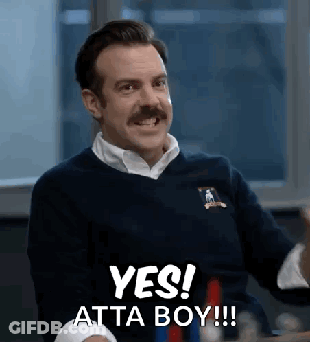 A Man With A Mustache Is Smiling And Saying Yes ! Atta Boy !!! GIF