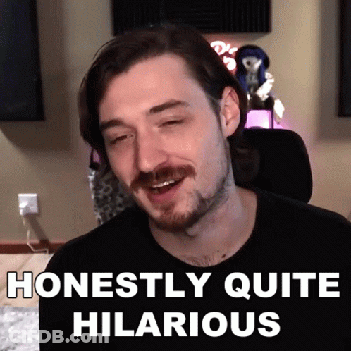 A Man With A Mustache Is Smiling With The Words Honestly Quite Hilarious Below Him GIF