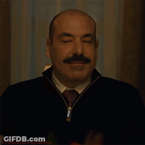 A Man With A Mustache Is Smiling With The Words Let 'S Eat Behind Him GIF