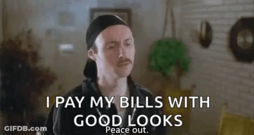 A Man With A Mustache Is Standing In A Living Room And Saying `` I Pay My Bills With Good Looks Peace Out '' GIF