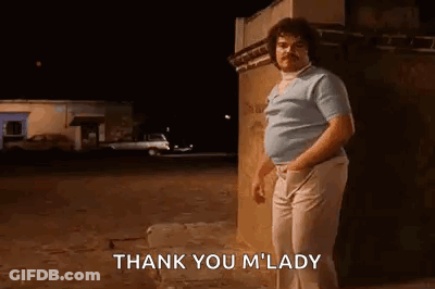 A Man With A Mustache Is Standing In Front Of A Building At Night And Saying `` Thank You M ' Lady '' . GIF