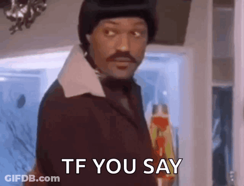 A Man With A Mustache Is Standing In Front Of A Door And Says `` Tf You Say '' . GIF