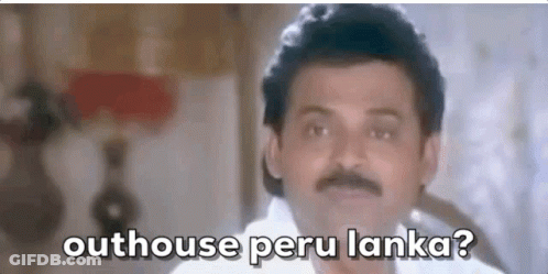 A Man With A Mustache Is Standing In Front Of A Lamp And Says `` Outhouse Peru Lanka ? '' GIF