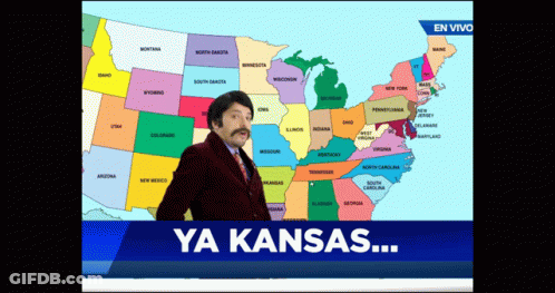 A Man With A Mustache Is Standing In Front Of A Map Of The United States And The Words Ya Kansas GIF